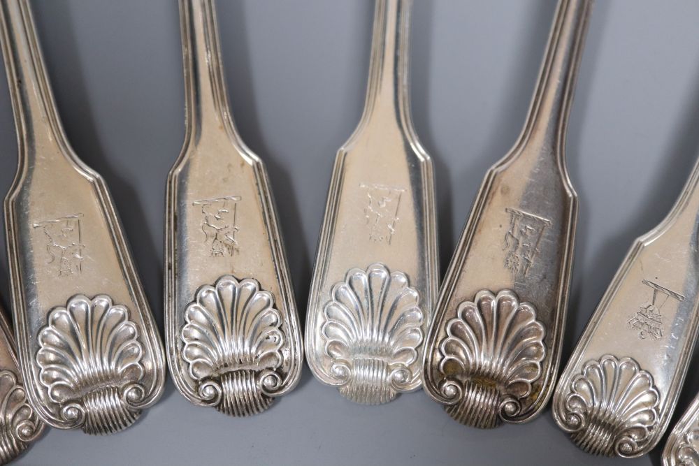 Four Victorian silver fiddle, thread and shell pattern table spoons & 4 dessert spoons.